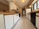 Bright kitchen with white cabinets and modern appliances at 32 Melstone Turn, Durham, NC 27707