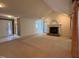 Cozy living room with a fireplace and large windows at 32 Melstone Turn, Durham, NC 27707