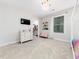 Bright bedroom features modern decor, including book shelves, a chandelier, and walk-in closet at 325 Azalea Gaze Dr, Youngsville, NC 27596