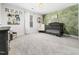 Charming Bedroom with a unique painted accent wall, decorative shelving, and a stylish crib at 325 Azalea Gaze Dr, Youngsville, NC 27596