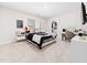 Relaxing bedroom features a cozy carpet, walk-in closet, and a vanity area for getting ready at 325 Azalea Gaze Dr, Youngsville, NC 27596
