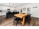 Bright open kitchen and dining area with a large kitchen island, modern appliances, and a spacious pantry at 325 Azalea Gaze Dr, Youngsville, NC 27596
