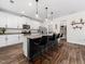 Stylish kitchen with white cabinets, granite countertops, stainless steel appliances, and pantry at 325 Azalea Gaze Dr, Youngsville, NC 27596