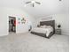 Large main bedroom with a walk-in closet, plush carpet, and a vaulted ceiling at 325 Azalea Gaze Dr, Youngsville, NC 27596