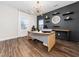 Bright office featuring a modern desk, stylish lighting, and built-in shelving at 325 Azalea Gaze Dr, Youngsville, NC 27596