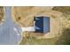 Aerial view of a new home on a spacious lot with a driveway and manicured lawn at 3306 Leaflet Church Rd, Broadway, NC 27505