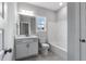Bathroom with single vanity, a shower-tub combo, tile floors, and white cabinets at 3306 Leaflet Church Rd, Broadway, NC 27505