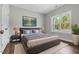Inviting bedroom with a king-size bed, nightstands, and a window with a view at 3306 Leaflet Church Rd, Broadway, NC 27505