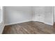 Bedroom with wood-look flooring, white trim, and neutral wall color at 3306 Leaflet Church Rd, Broadway, NC 27505