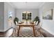 Elegant dining room with a wooden table, six chairs, and a chandelier at 3306 Leaflet Church Rd, Broadway, NC 27505