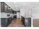 Kitchen with granite counters, dark cabinets and stainless steel appliances at 3306 Leaflet Church Rd, Broadway, NC 27505