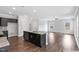 Open concept kitchen with large island overlooking living room at 3306 Leaflet Church Rd, Broadway, NC 27505