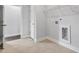 Functional laundry room featuring neutral walls, tile flooring, and convenient wire shelving for storage at 3306 Leaflet Church Rd, Broadway, NC 27505