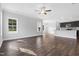 Open concept living room with wood-look floors, large windows and neutral walls at 3306 Leaflet Church Rd, Broadway, NC 27505