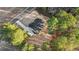 A beautiful aerial view of a single-Gathering home with a driveway and plenty of tree coverage at 3328 Leaflet Church Rd, Broadway, NC 27505