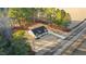 Picturesque overhead shot of a home surrounded by dense green trees and adjacent to an open field at 3328 Leaflet Church Rd, Broadway, NC 27505