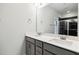 Bathroom features double sinks, quartz countertops, and a glass enclosed shower with dark tiling at 3328 Leaflet Church Rd, Broadway, NC 27505