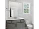 Bathroom features a toilet, vanity, and large mirror at 3328 Leaflet Church Rd, Broadway, NC 27505