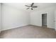 Neutral bedroom has carpet, ceiling fan, and a door to a closet at 3328 Leaflet Church Rd, Broadway, NC 27505