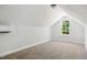 Neutral carpet, light walls, and a window offering natural light make this a cozy bedroom at 3328 Leaflet Church Rd, Broadway, NC 27505