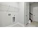 This laundry room has a neutral tile floor and a utility sink at 3328 Leaflet Church Rd, Broadway, NC 27505