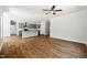 Large living room featuring hardwood floors, a ceiling fan and a view to the kitchen at 3328 Leaflet Church Rd, Broadway, NC 27505