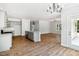 An open-concept living area with kitchen access and plenty of natural light at 3328 Leaflet Church Rd, Broadway, NC 27505