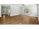 The main bedroom with hardwood floors, a ceiling fan, and a window at 3328 Leaflet Church Rd, Broadway, NC 27505