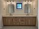 Bathroom features dual vanities, modern fixtures, and a decorative mirror at 3601 Bivins Rd, Hillsborough, NC 27278