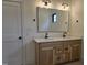Bathroom with a double vanity with two sinks and a large mirror at 3601 Bivins Rd, Hillsborough, NC 27278
