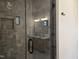 Bathroom featuring gray tile shower with glass door, a window, and modern vanity at 3601 Bivins Rd, Hillsborough, NC 27278