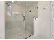Modern bathroom with glass shower enclosure, rainfall showerhead, and built-in seat, offering a spa-like experience at 3601 Bivins Rd, Hillsborough, NC 27278