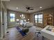 This bedroom features great natural light, wood floors, modern furniture, and a large window at 3601 Bivins Rd, Hillsborough, NC 27278