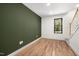 Guest bedroom featuring a window, hardwood floors, and neutral paint at 3601 Bivins Rd, Hillsborough, NC 27278