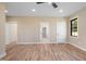Bright and airy bedroom with hardwood flooring, neutral walls, and multiple doorways, creating a welcoming atmosphere at 3601 Bivins Rd, Hillsborough, NC 27278