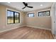 Bedroom with hardwood floors, a ceiling fan, and well-lit windows at 3601 Bivins Rd, Hillsborough, NC 27278