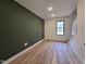 Bonus room features sleek hardwood flooring and natural light at 3601 Bivins Rd, Hillsborough, NC 27278