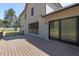 Exterior of home showing the wood deck with black railing and sliding glass doors at 3601 Bivins Rd, Hillsborough, NC 27278