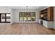 Elegant dining room with natural light, built-in bar area, and hardwood floors perfect for entertaining at 3601 Bivins Rd, Hillsborough, NC 27278