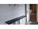 Entryway with built-in shelving, a bench, and gray brick floors at 3601 Bivins Rd, Hillsborough, NC 27278