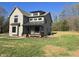Charming two-story home with covered front porch and mature trees at 3601 Bivins Rd, Hillsborough, NC 27278