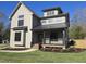 Charming two-story home with neutral siding, dark trim, and a welcoming front porch at 3601 Bivins Rd, Hillsborough, NC 27278