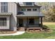 Charming front porch with black railings and metal roof offers a cozy entrance to this modern home at 3601 Bivins Rd, Hillsborough, NC 27278