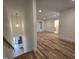Spacious hallway with hardwood floors leads to various rooms in the house at 3601 Bivins Rd, Hillsborough, NC 27278
