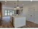 Bright kitchen features a large island with seating and an open floor plan to dining area at 3601 Bivins Rd, Hillsborough, NC 27278
