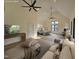 Open living room with vaulted ceilings, modern decor, and lots of natural light at 3601 Bivins Rd, Hillsborough, NC 27278