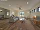 Virtually staged living room with hardwood floors, recessed lighting, and view to the backyard at 3601 Bivins Rd, Hillsborough, NC 27278