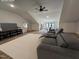 Spacious living room with vaulted ceilings, modern decor, and a comfortable reclining sofa at 3601 Bivins Rd, Hillsborough, NC 27278