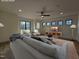 Virtually staged living room with large windows, hardwood floors, and recessed lights at 3601 Bivins Rd, Hillsborough, NC 27278