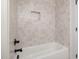 Shower with decorative tile surround and modern fixtures at 3601 Bivins Rd, Hillsborough, NC 27278